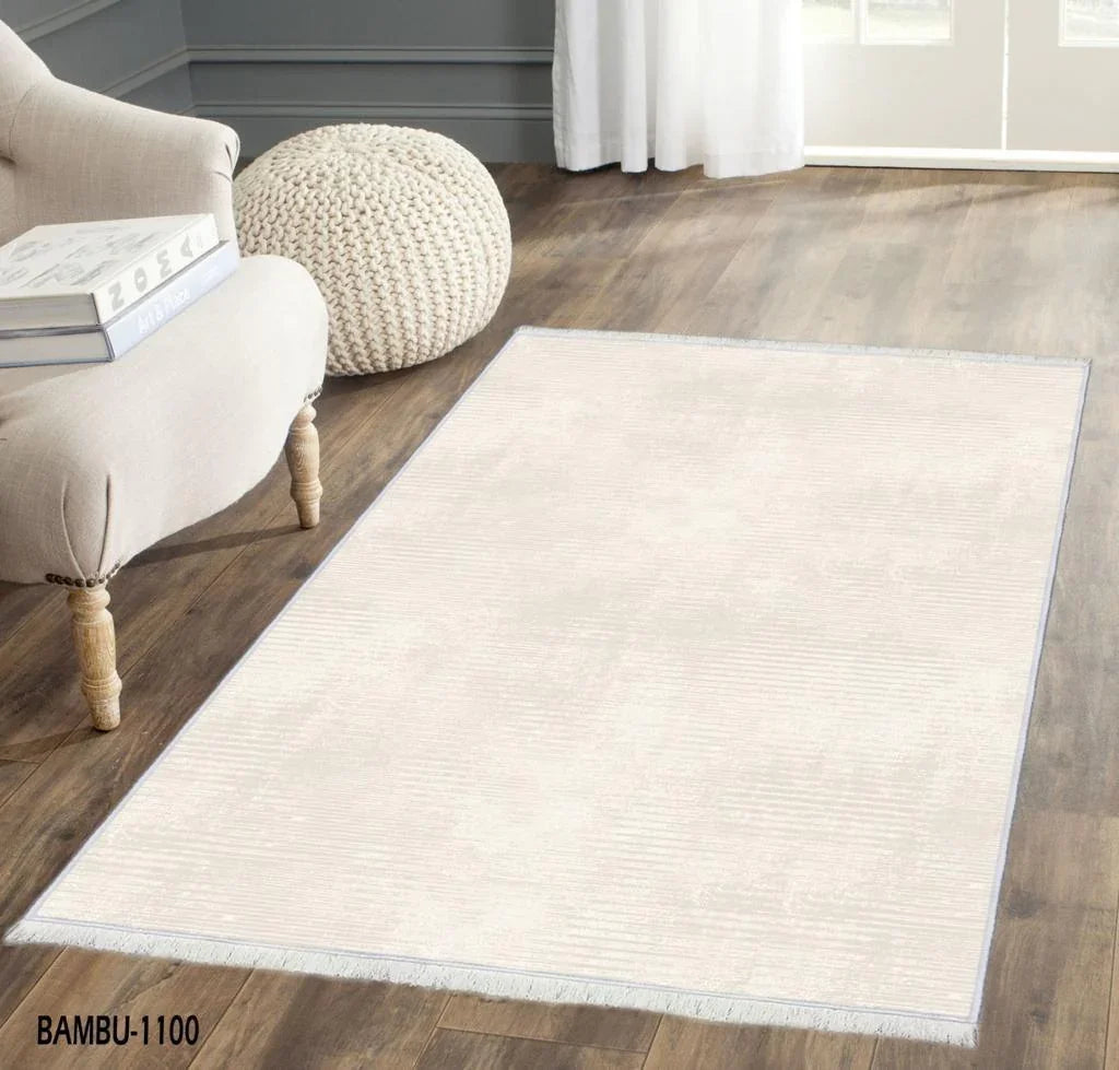 Modern living room with a light beige washable area rug on wooden floor