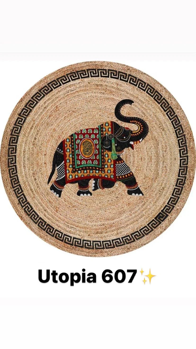 Round natural fiber rug with decorative black elephant and geometric border design