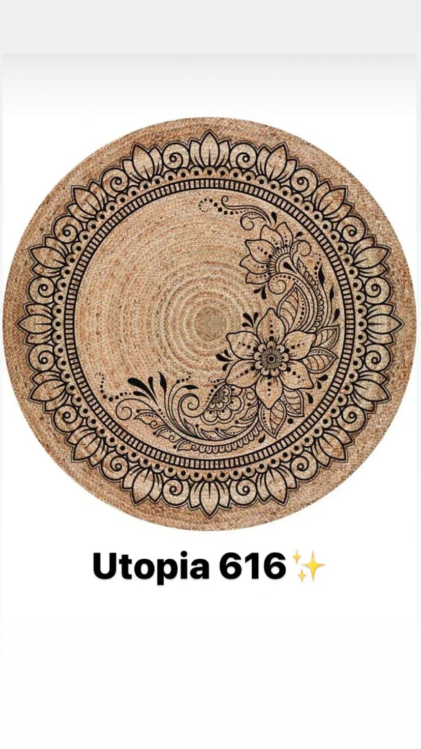 Round natural woven rug with black mandala floral pattern, labeled Utopia 616.