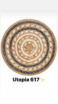 Round natural fiber rug with black and beige patterns, Utopia 617 design.