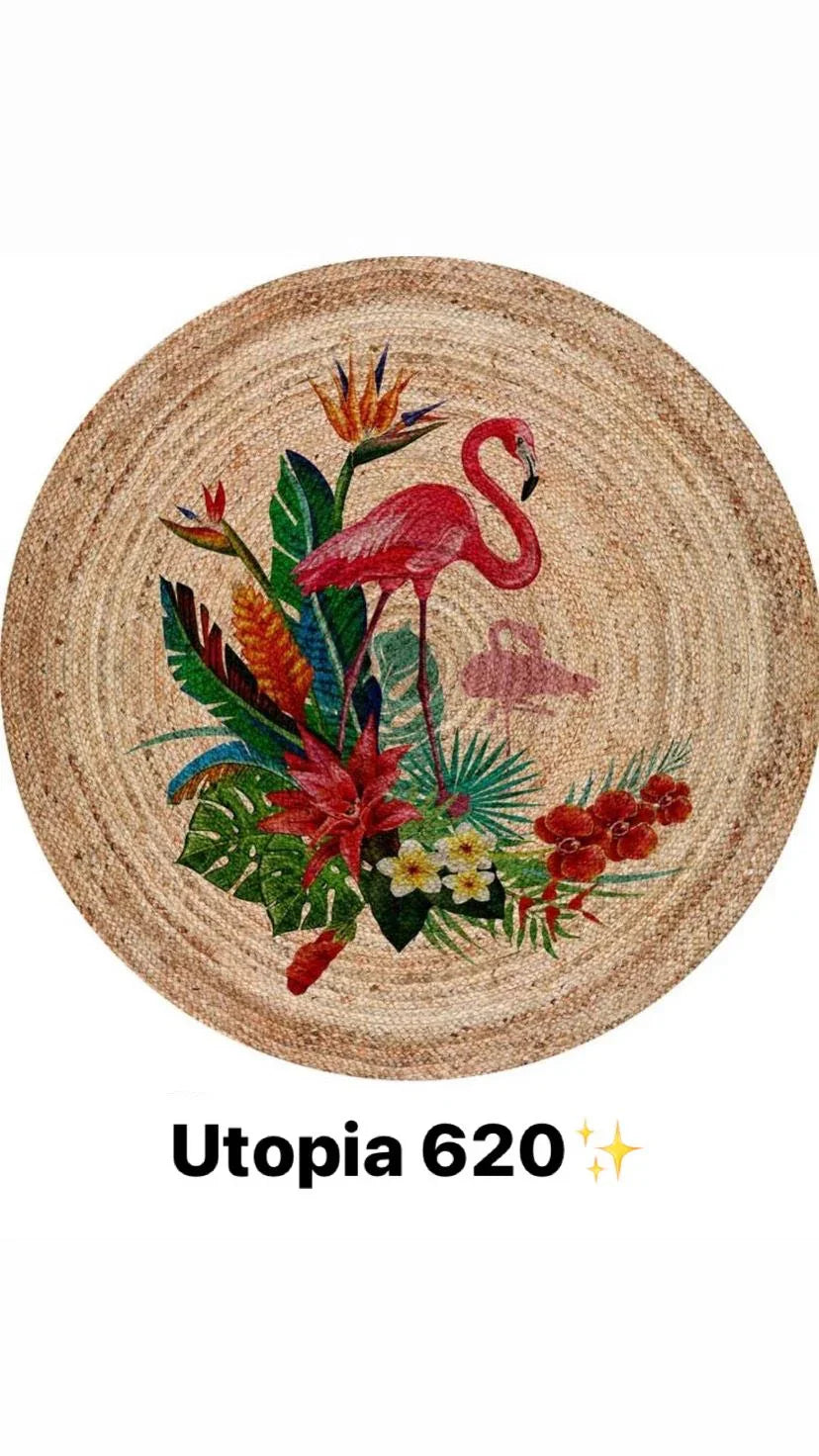 Round woven rug with a pink flamingo and tropical flowers design, natural fiber look