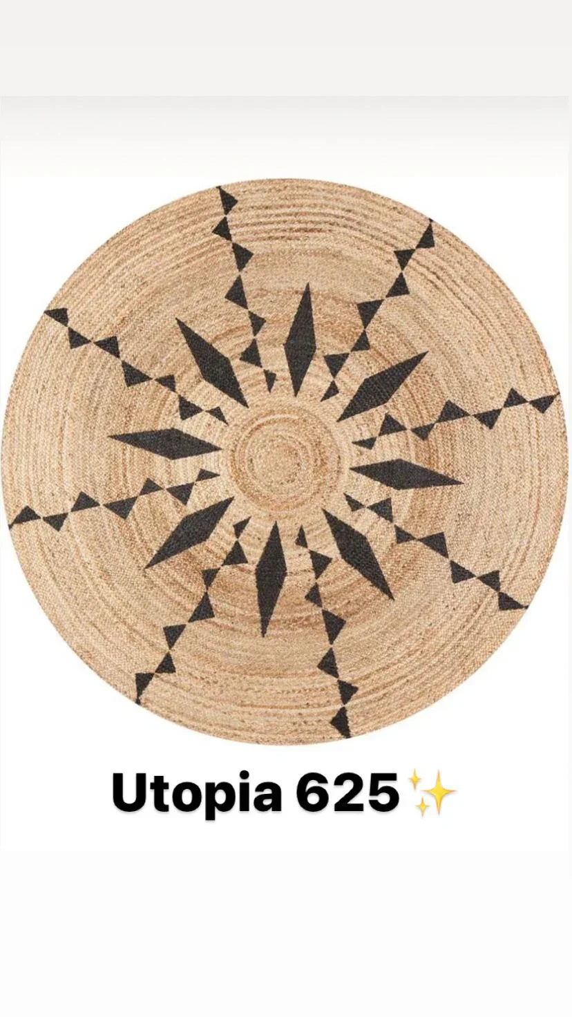 Round natural jute rug with black geometric starburst pattern, boho style design