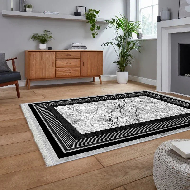 Modern washable rug with black and white marble pattern in a stylish living room