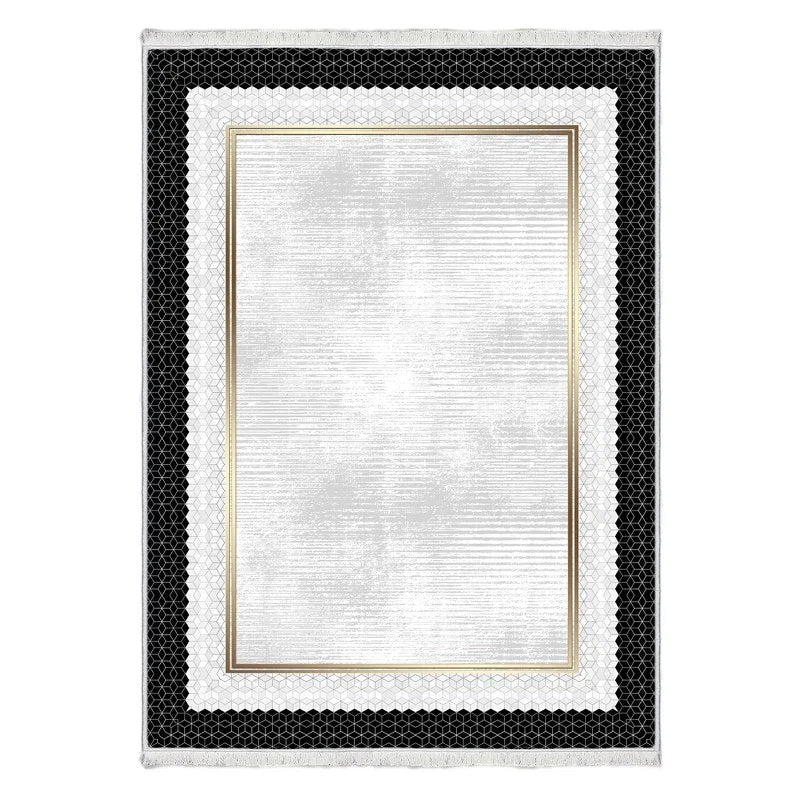 Modern washable area rug with white center, gold border, and black geometric patterned edges