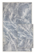 Modern washable area rug with blue and white marble pattern, shown in two sizes
